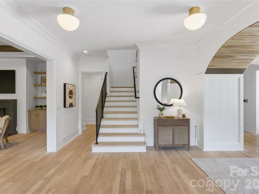 7005 Chateau Bordeaux Lane, Charlotte, NC 28270.  MLS# CAR4361151, YatesRealty ID 17330. Thoughtfully designed transitional space highlighted by clean architectural lines, warm hardwoods, and a cohesive flow connecting the home’s living areas