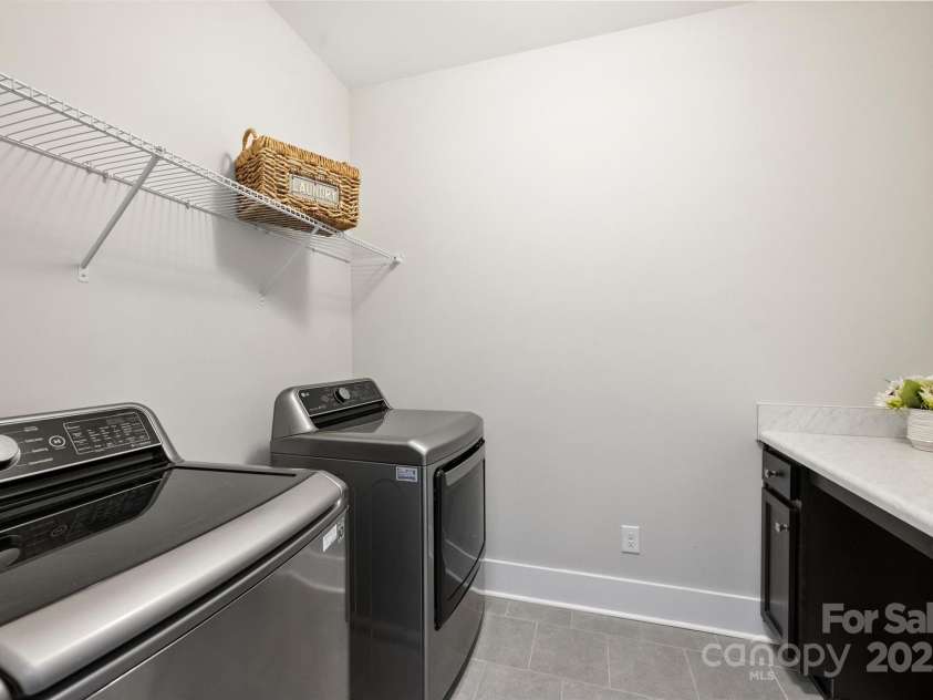 1209 Leigh Avenue, Charlotte, NC 28205.  MLS# CAR4295218, YatesRealty ID 17331. Laundry room on upper level