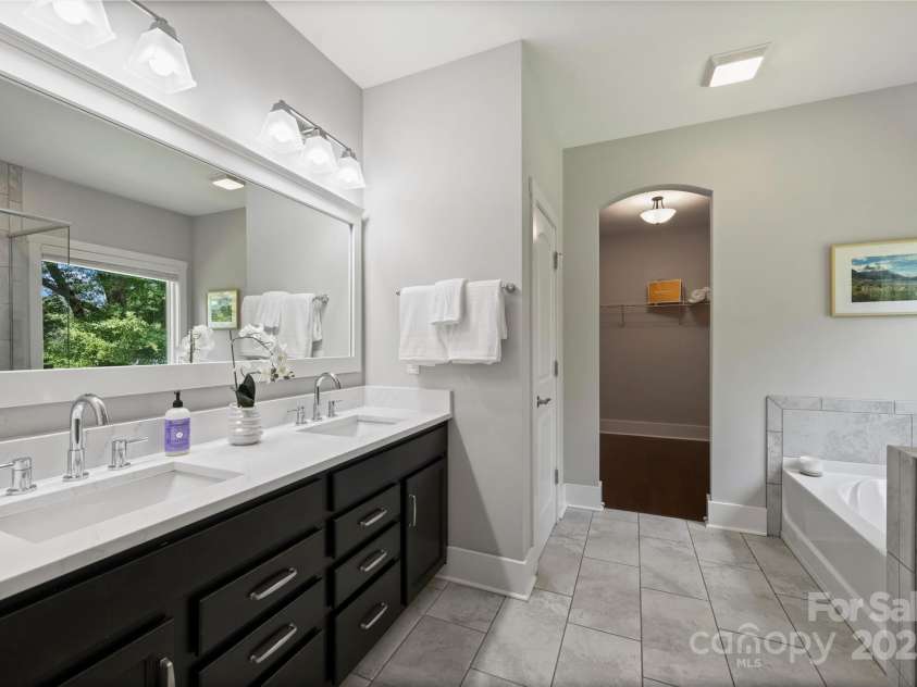 1209 Leigh Avenue, Charlotte, NC 28205.  MLS# CAR4295218, YatesRealty ID 17331. New quartz counters and faucets in primary bath!