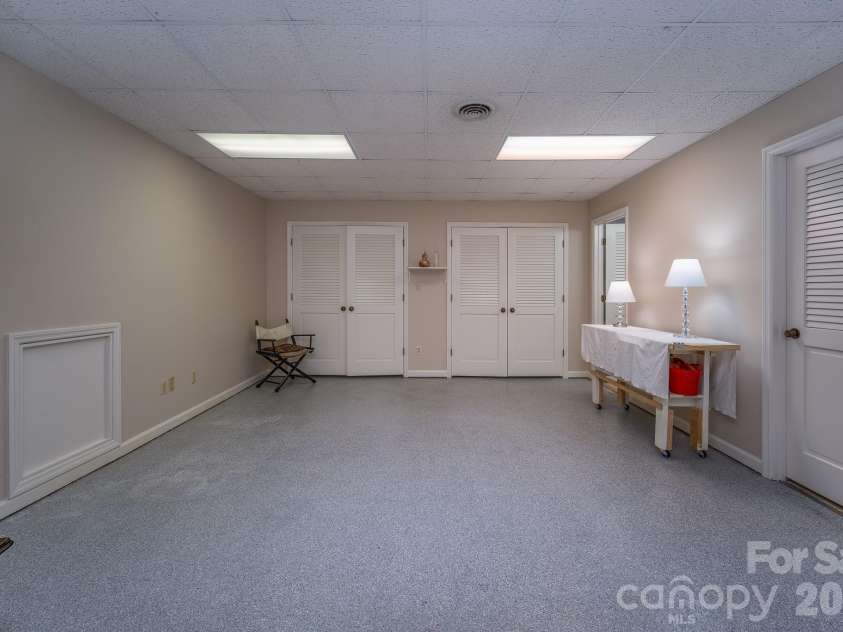 1955 Connestee Trail, Brevard, NC 28712.  MLS# CAR4313257, YatesRealty ID 17335. Expansive craft/studio
