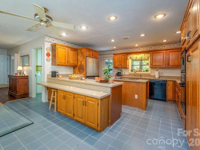 1955 Connestee Trail, Brevard, NC 28712.  MLS# CAR4313257, YatesRealty ID 17335. Large functional kitchen