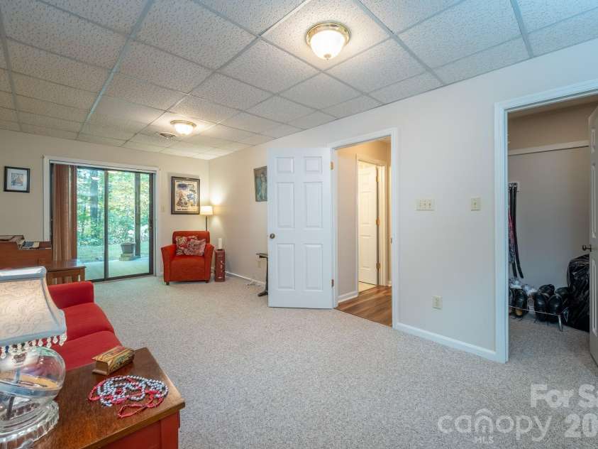 1955 Connestee Trail, Brevard, NC 28712.  MLS# CAR4313257, YatesRealty ID 17335. Lower-level 3rd bedroom