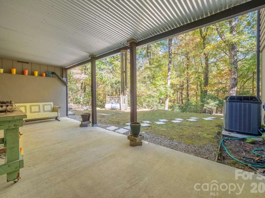 1955 Connestee Trail, Brevard, NC 28712.  MLS# CAR4313257, YatesRealty ID 17335. Lower-level patio