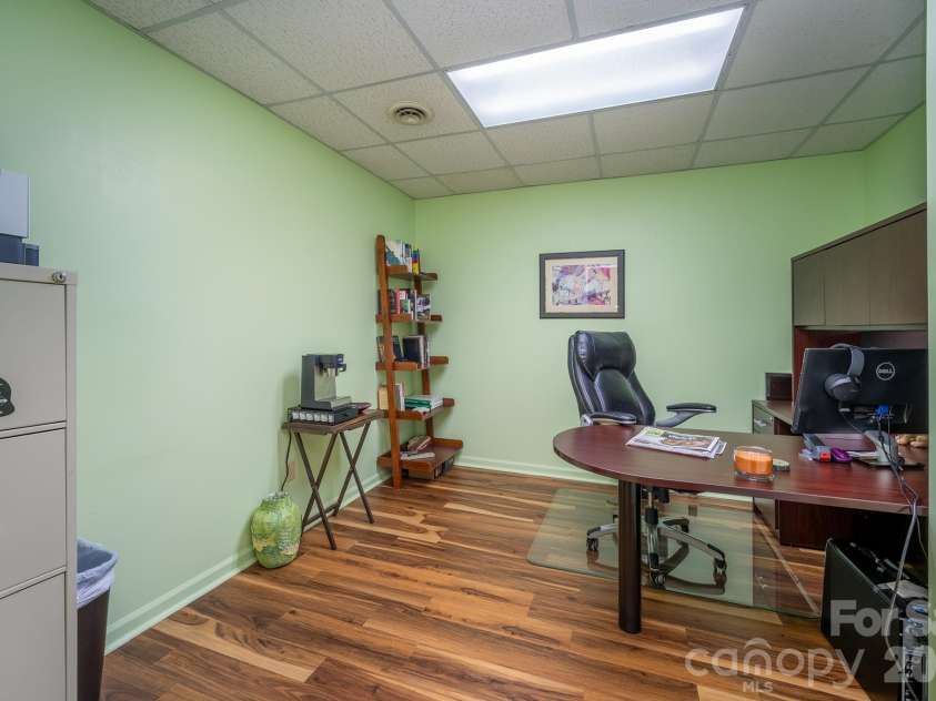 1955 Connestee Trail, Brevard, NC 28712.  MLS# CAR4313257, YatesRealty ID 17335. Office space on lower level