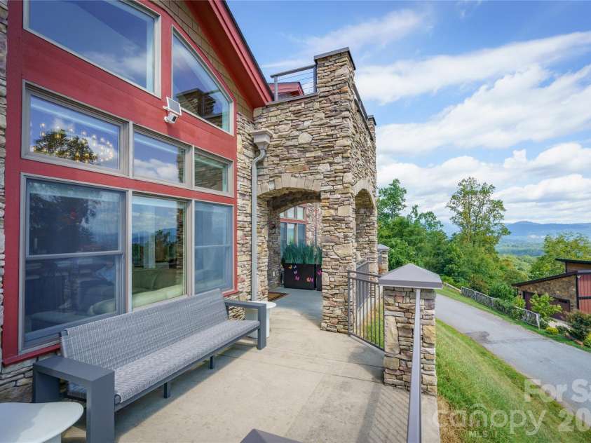 4 Chimney Crest Drive, Asheville, NC 28806.  MLS# CAR4421093, YatesRealty ID 17341. Main level patio with covered area
