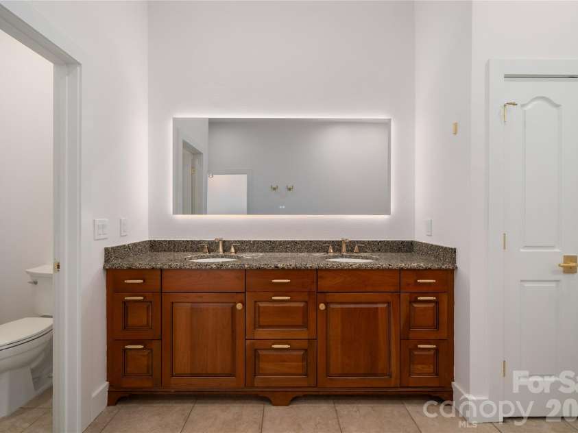 4 Chimney Crest Drive, Asheville, NC 28806.  MLS# CAR4421093, YatesRealty ID 17341. Primary with separate commode area with sprayer