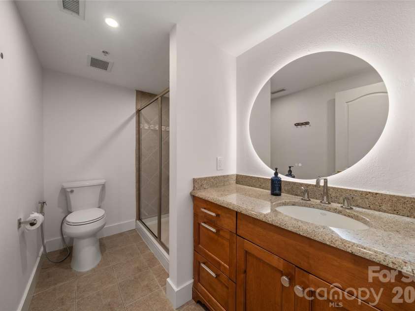 4 Chimney Crest Drive, Asheville, NC 28806.  MLS# CAR4421093, YatesRealty ID 17341. Upper full bath with smart mirror