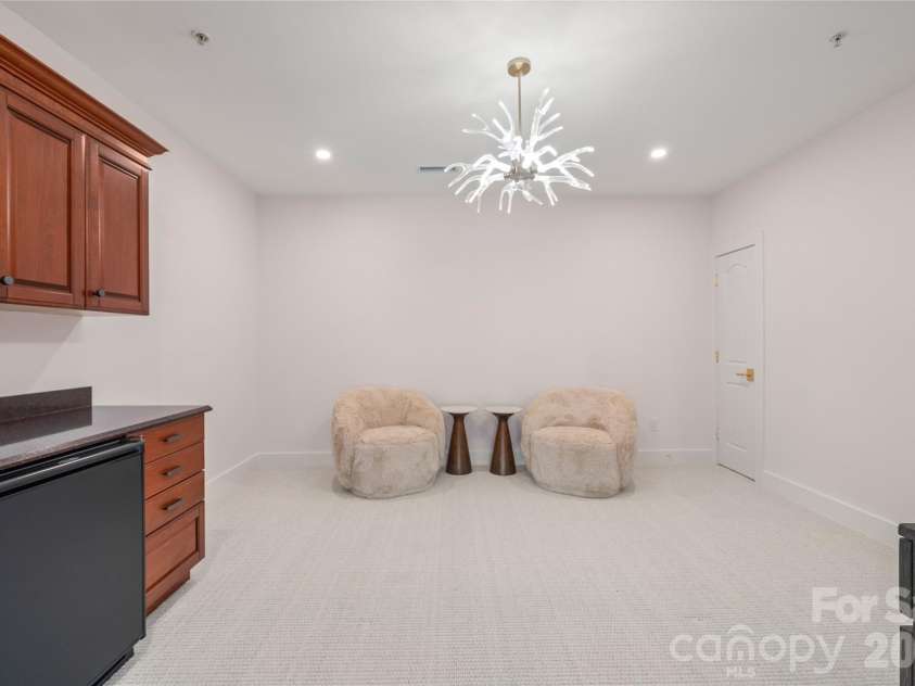 4 Chimney Crest Drive, Asheville, NC 28806.  MLS# CAR4421093, YatesRealty ID 17341. Upper recreation/flex room with wet bar and beverage refrigerator