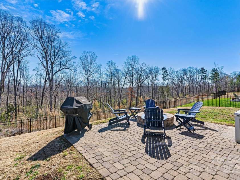 3193 Burnello Court, Iron Station, NC 28080.  MLS# CAR4234099, YatesRealty ID 17342. Fenced yard with pavers and fire pit