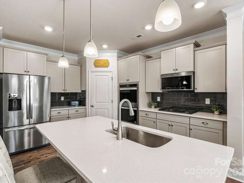 3193 Burnello Court, Iron Station, NC 28080.  MLS# CAR4234099, YatesRealty ID 17342. Stainless appliances and 5 burner gas cooktop