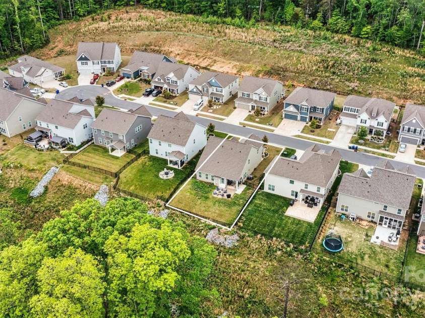 3193 Burnello Court, Iron Station, NC 28080.  MLS# CAR4234099, YatesRealty ID 17342. The yard backs up to beautiful woods