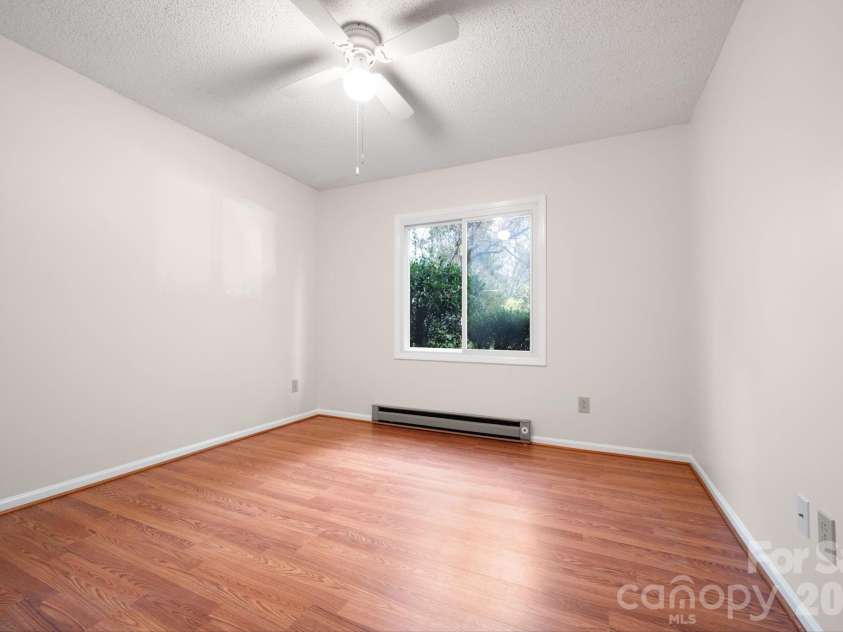 24 Green Acres Drive, Candler, NC 28715.  MLS# CAR4318408, YatesRealty ID 17347. Comfortable Secondary Bedroom Overlooking The Front Yard