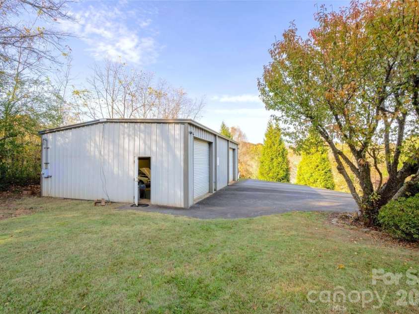 24 Green Acres Drive, Candler, NC 28715.  MLS# CAR4318408, YatesRealty ID 17347. Expansive Space With Roll-Up Doors