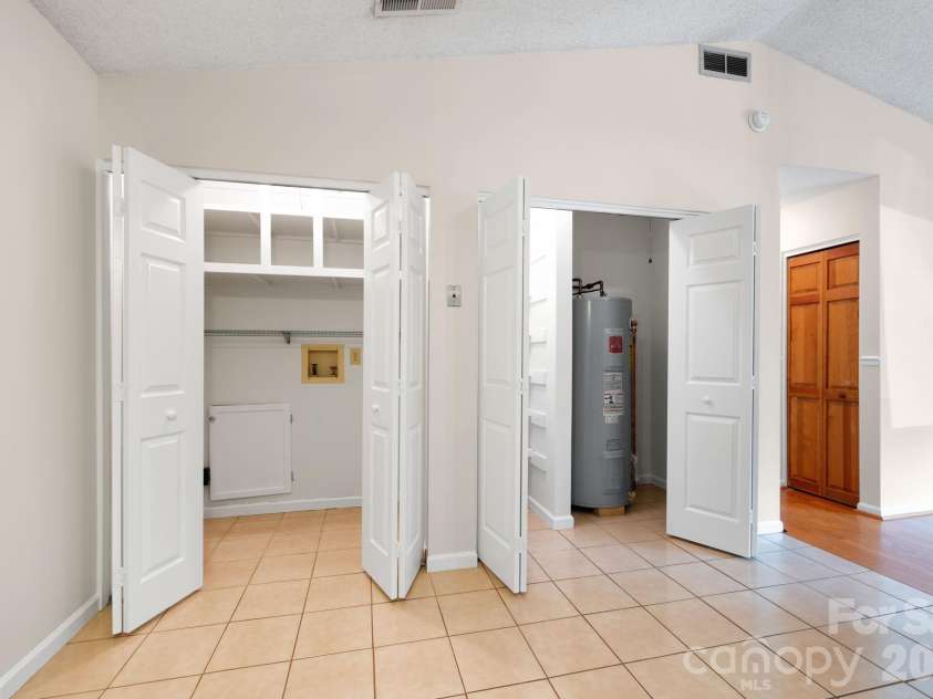 24 Green Acres Drive, Candler, NC 28715.  MLS# CAR4318408, YatesRealty ID 17347. Laundry And Utility Area With Extra Storage