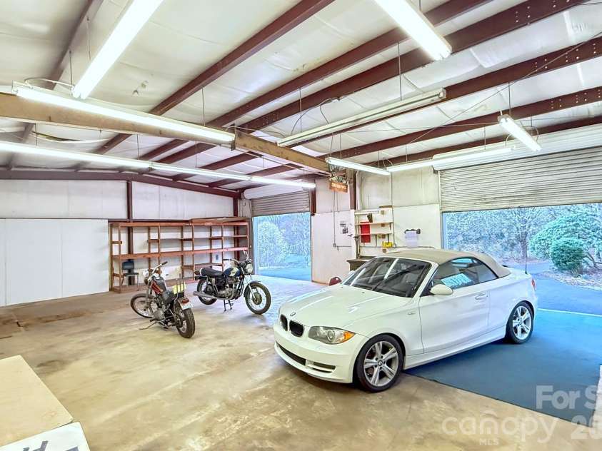 24 Green Acres Drive, Candler, NC 28715.  MLS# CAR4318408, YatesRealty ID 17347. Multiple Bays Offer The Perfect Space For Projects And Hobbies