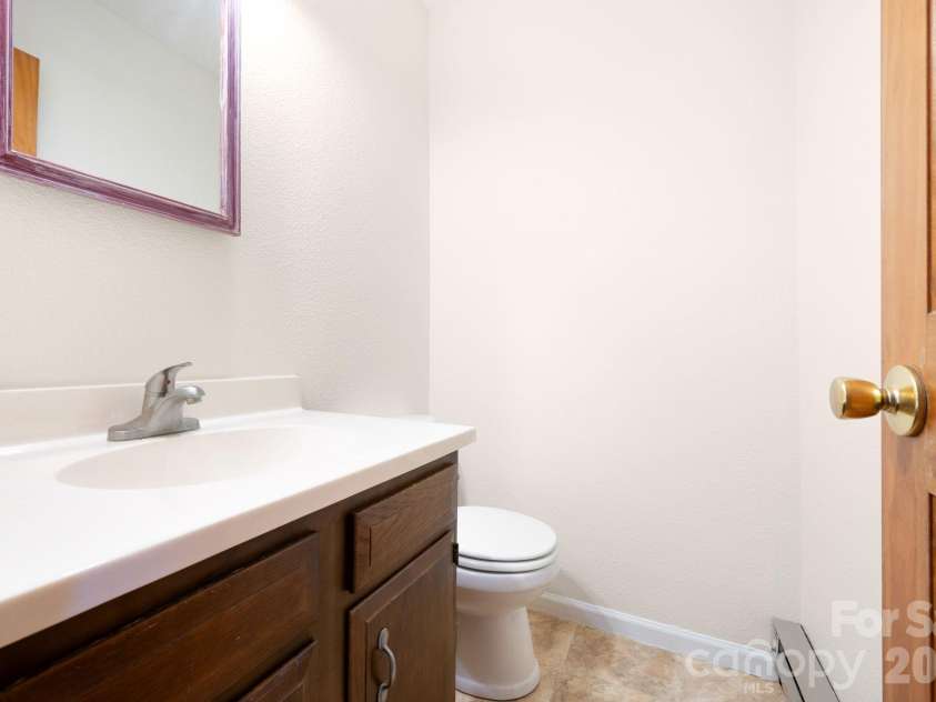 24 Green Acres Drive, Candler, NC 28715.  MLS# CAR4318408, YatesRealty ID 17347. Primary Half Bath