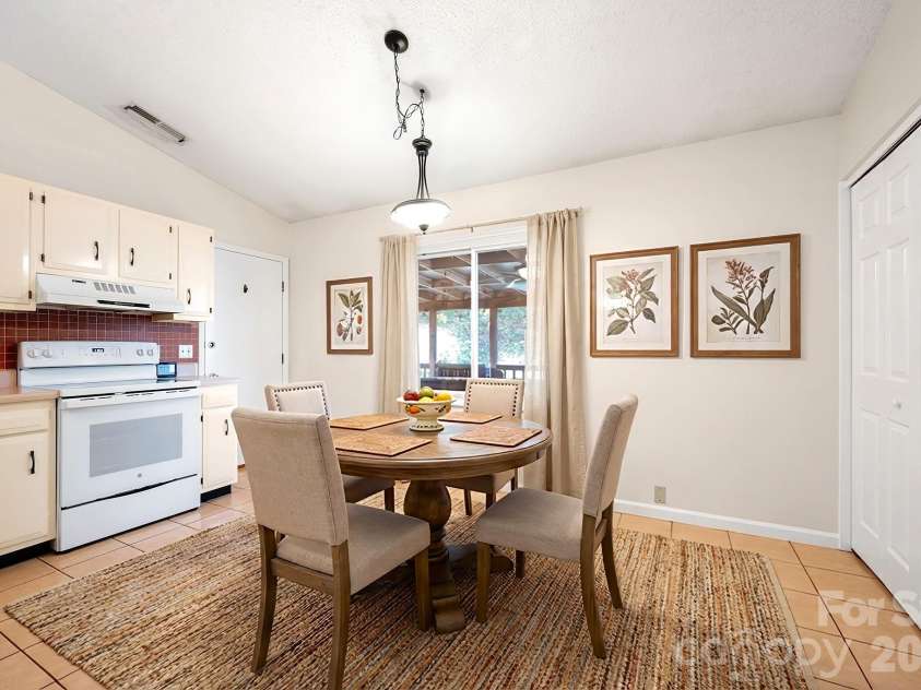 24 Green Acres Drive, Candler, NC 28715.  MLS# CAR4318408, YatesRealty ID 17347. Virtually Staged Dining Area