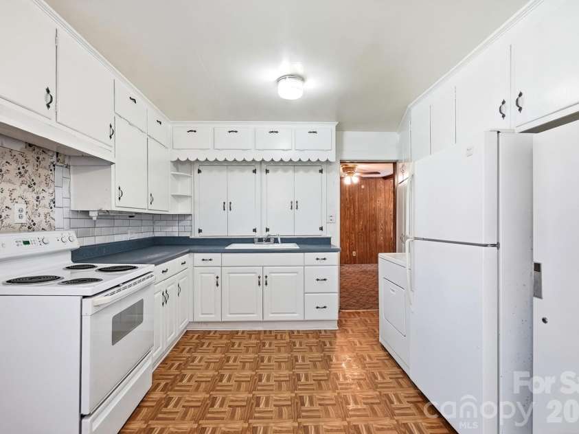 2517 Plum Street, Charlotte, NC 28269.  MLS# CAR4397203, YatesRealty ID 17348. Washer in Kitchen
