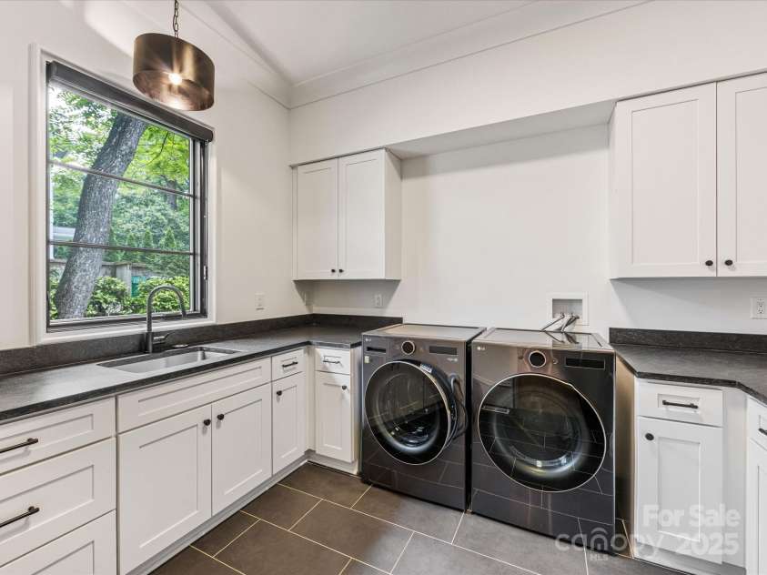 438 Wonderwood Drive, Charlotte, NC 28211.  MLS# CAR4290374, YatesRealty ID 17355. Laundry Room on Main floor with second refrigerator