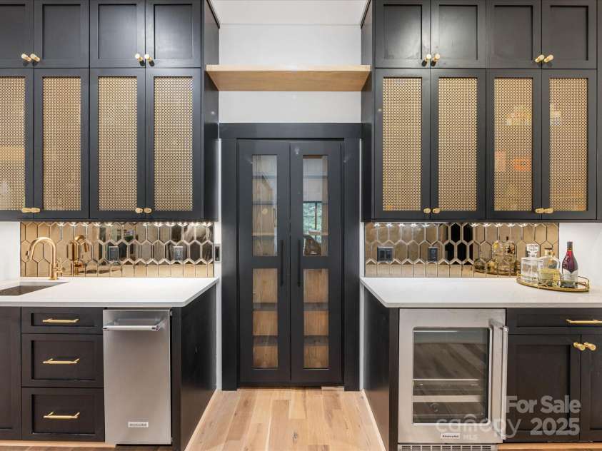 438 Wonderwood Drive, Charlotte, NC 28211.  MLS# CAR4290374, YatesRealty ID 17355. Scullery with hidden biometric glass framed door to Dining Room