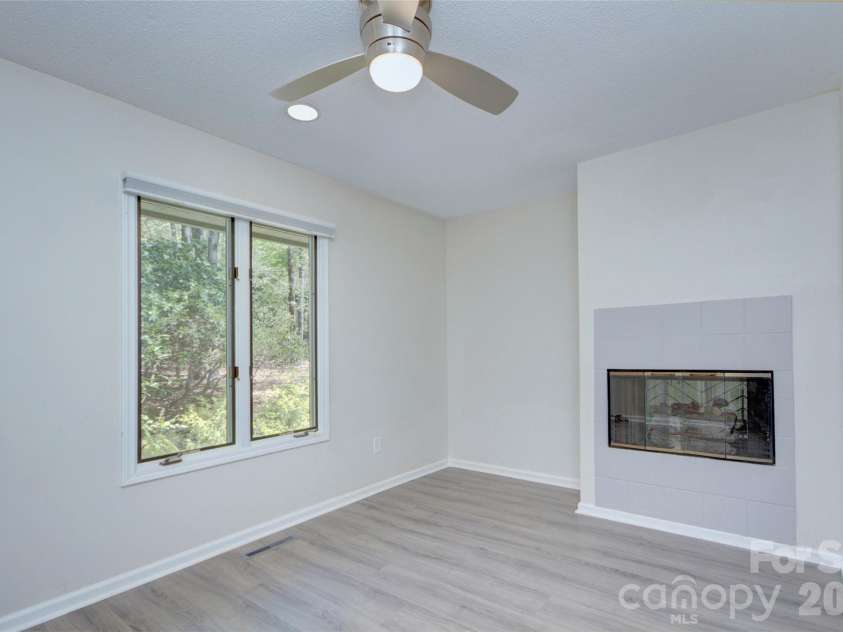960 Middle Connestee Trail, Brevard, NC 28712.  MLS# CAR4373421, YatesRealty ID 17355. Bedroom #3 with double fireplace