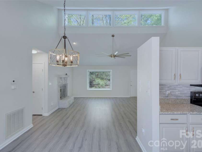 960 Middle Connestee Trail, Brevard, NC 28712.  MLS# CAR4373421, YatesRealty ID 17355. Dining room view from Kitchen area