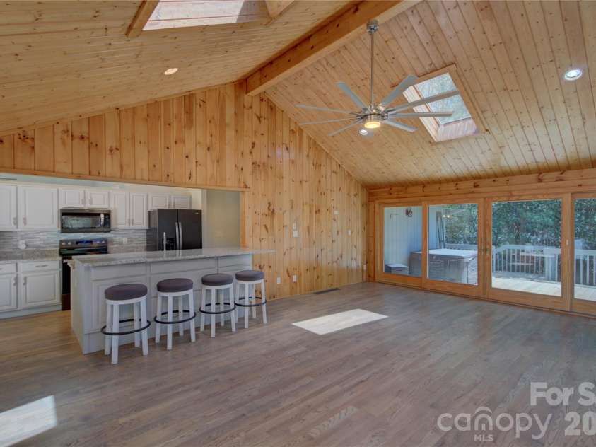 960 Middle Connestee Trail, Brevard, NC 28712.  MLS# CAR4373421, YatesRealty ID 17355. Family room facing Kitchen