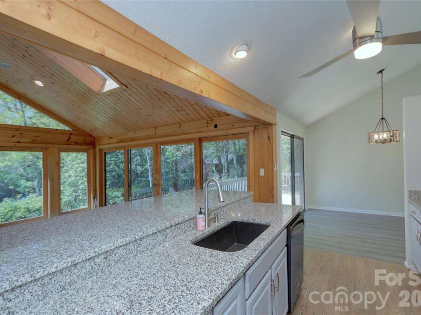 960 Middle Connestee Trail, Brevard, NC 28712.  MLS# CAR4373421, YatesRealty ID 17355. Family room view from Kitchen