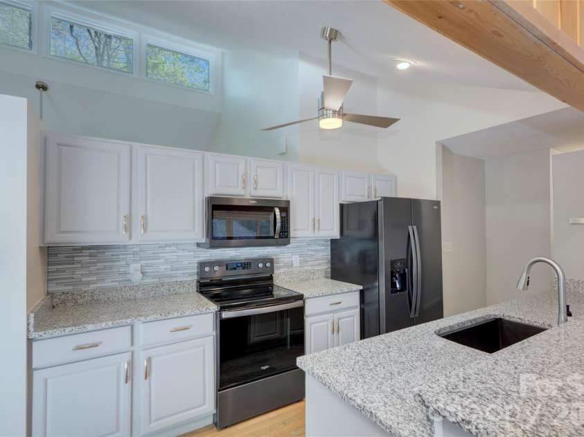 960 Middle Connestee Trail, Brevard, NC 28712.  MLS# CAR4373421, YatesRealty ID 17355. Kitchen View from family room