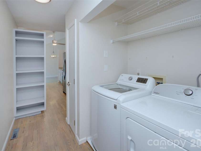 960 Middle Connestee Trail, Brevard, NC 28712.  MLS# CAR4373421, YatesRealty ID 17355. Laundry room closet off Kitchen