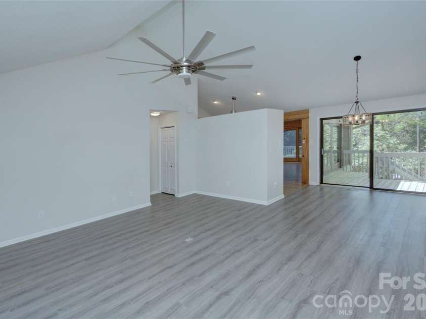 960 Middle Connestee Trail, Brevard, NC 28712.  MLS# CAR4373421, YatesRealty ID 17355. Living room and dining room view