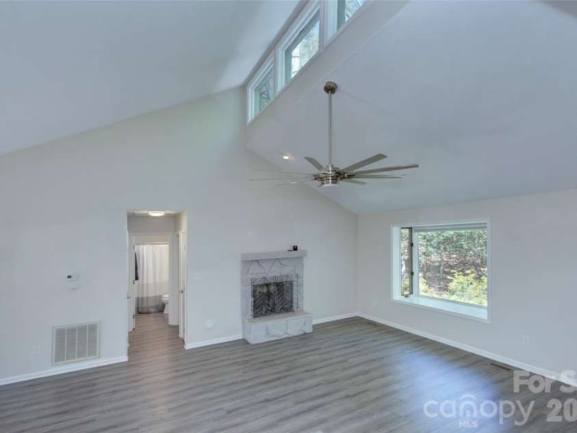 960 Middle Connestee Trail, Brevard, NC 28712.  MLS# CAR4373421, YatesRealty ID 17355. Living room area from Kitchen area