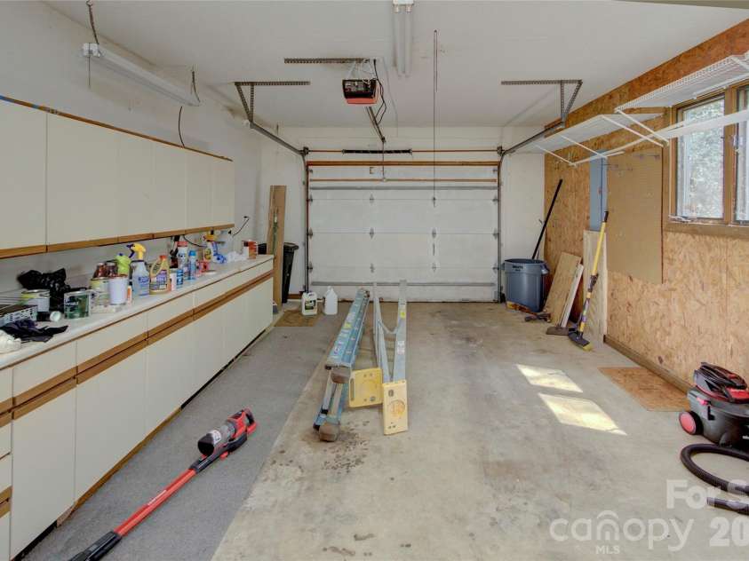 960 Middle Connestee Trail, Brevard, NC 28712.  MLS# CAR4373421, YatesRealty ID 17355. One Car Garage with Storage area