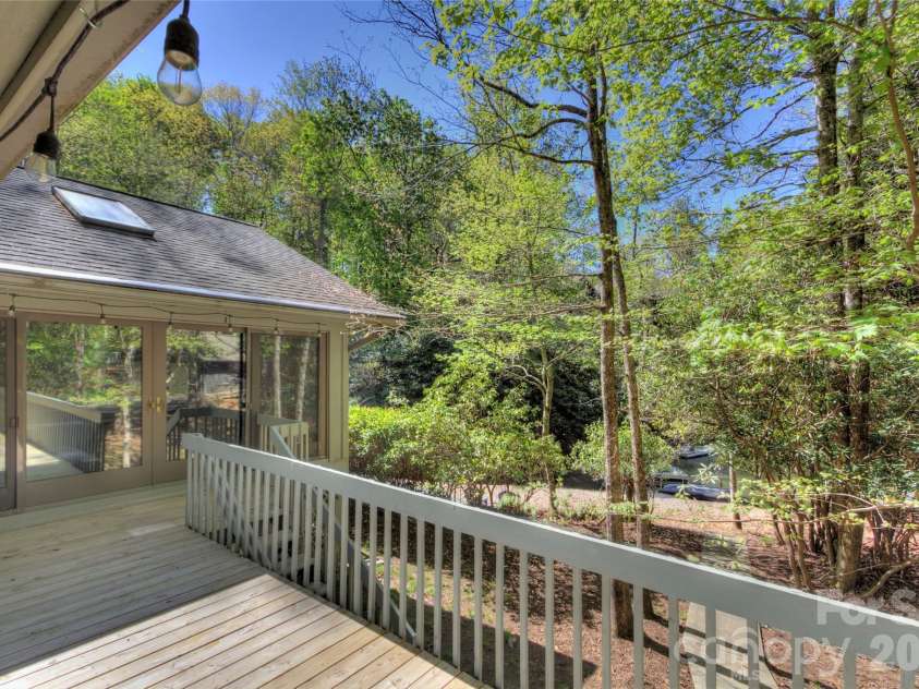 960 Middle Connestee Trail, Brevard, NC 28712.  MLS# CAR4373421, YatesRealty ID 17355. Open side deck on with easy entry to Lake Tiaroga
