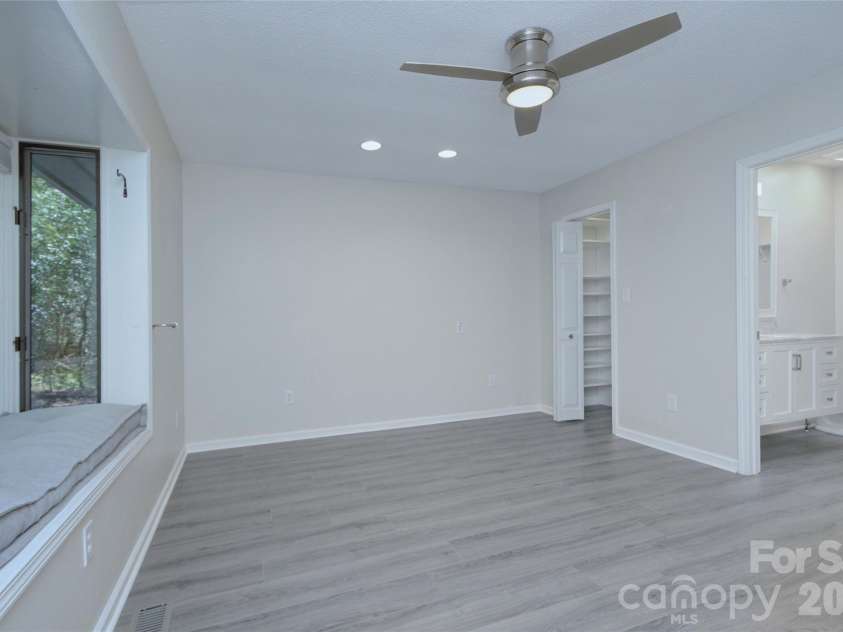 960 Middle Connestee Trail, Brevard, NC 28712.  MLS# CAR4373421, YatesRealty ID 17355. Primary Bedroom with window seat