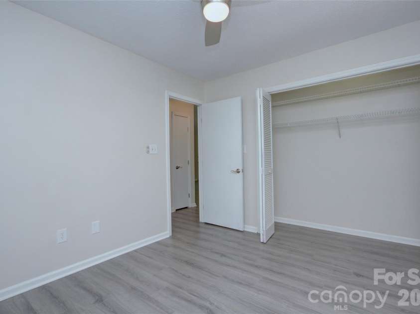 960 Middle Connestee Trail, Brevard, NC 28712.  MLS# CAR4373421, YatesRealty ID 17355. Second Bedroom showing closet