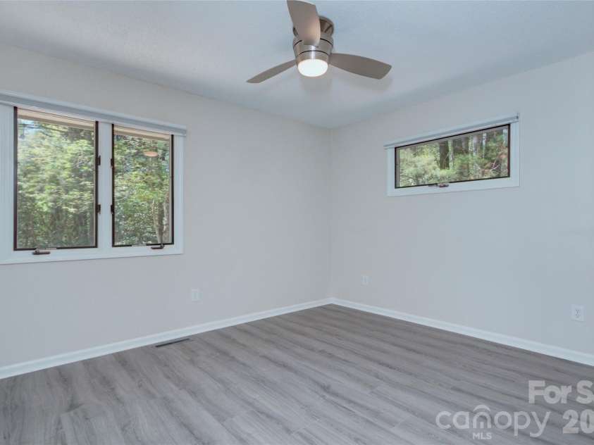 960 Middle Connestee Trail, Brevard, NC 28712.  MLS# CAR4373421, YatesRealty ID 17355. Second Bedroom with Lake view