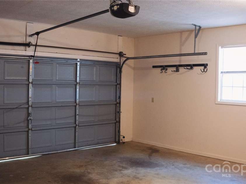 9 Manakiki Court, Etowah, NC 28729.  MLS# CAR4245266, YatesRealty ID 17356. Garage
