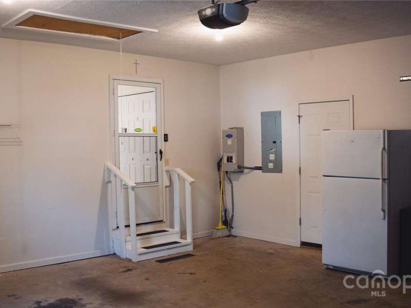 9 Manakiki Court, Etowah, NC 28729.  MLS# CAR4245266, YatesRealty ID 17356. Garage