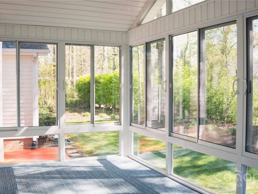 9 Manakiki Court, Etowah, NC 28729.  MLS# CAR4245266, YatesRealty ID 17356. Glasses Four Seasons Room