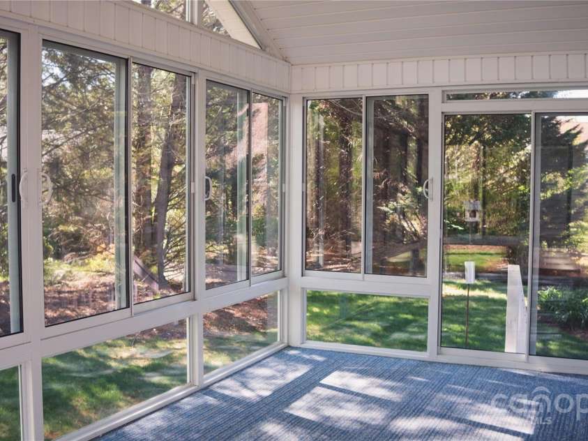9 Manakiki Court, Etowah, NC 28729.  MLS# CAR4245266, YatesRealty ID 17356. Glasses Four Seasons Room