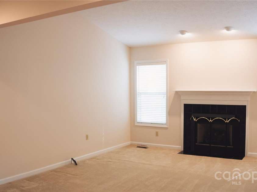 9 Manakiki Court, Etowah, NC 28729.  MLS# CAR4245266, YatesRealty ID 17356. Living room Fireplace