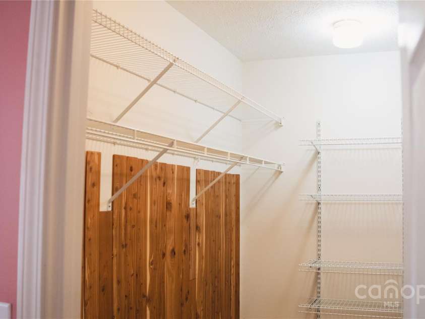 9 Manakiki Court, Etowah, NC 28729.  MLS# CAR4245266, YatesRealty ID 17356. Primary Bedroom large walk-in closet