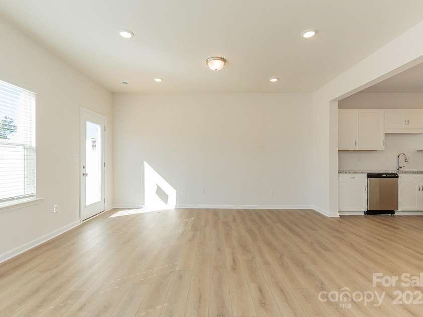 6024 Jasmine Branch Road, Charlotte, NC 28216.  MLS# CAR4260393, YatesRealty ID 17362. Suwanee Family Room