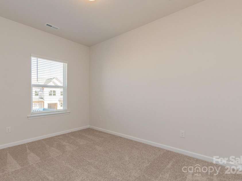 6024 Jasmine Branch Road, Charlotte, NC 28216.  MLS# CAR4260393, YatesRealty ID 17362. Suwanee Secondary Bedroom 1