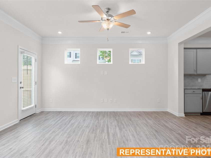 6005 Jasmine Branch Road, Charlotte, NC 28216.  MLS# CAR4260447, YatesRealty ID 17363. Suwanee Family Room