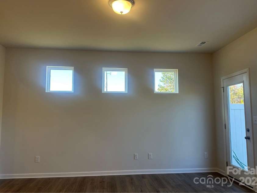 6005 Jasmine Branch Road, Charlotte, NC 28216.  MLS# CAR4260447, YatesRealty ID 17363. Suwanee Family Room