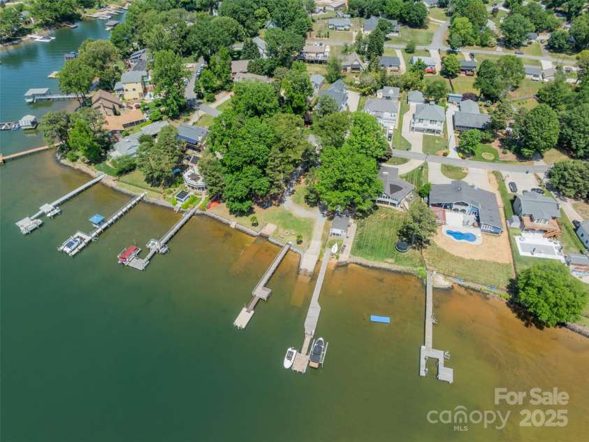 21614 Colina Drive, Cornelius, NC 28031.  MLS# CAR4255901, YatesRealty ID 17364. Community lake access lot and day dock