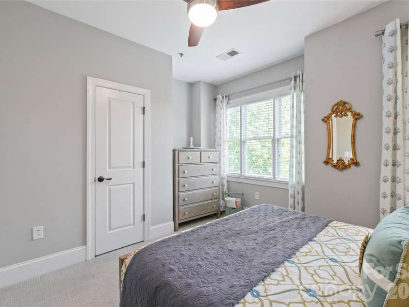 100 Laurel Avenue, Charlotte, NC 28207.  MLS# CAR4374036, YatesRealty ID 17367. Continuing the theme of organization, this second bedroom also features a custom-designed closet, providing  storage space for guests or a home office.