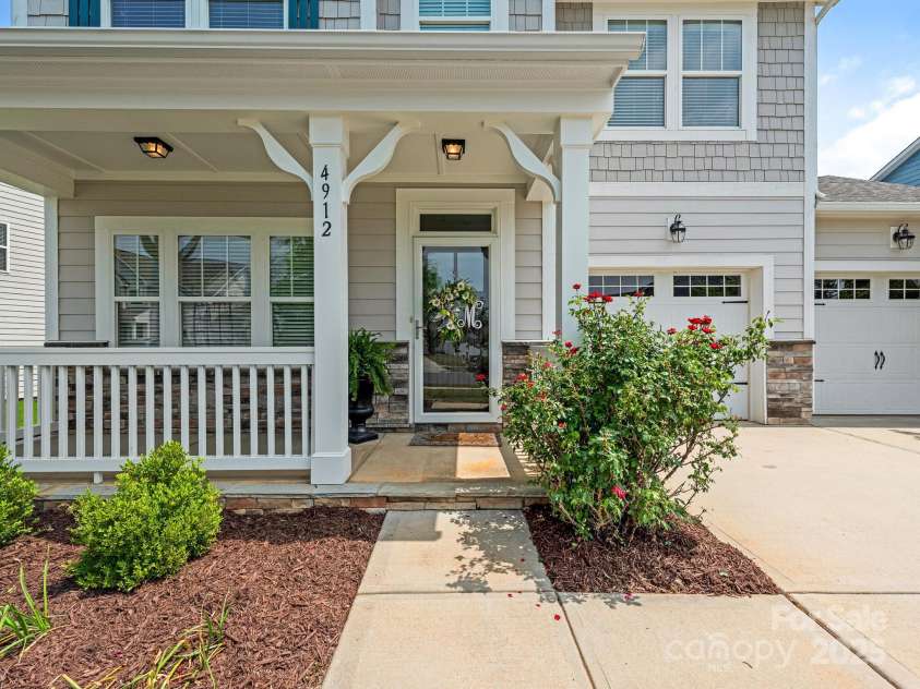 4912 Grace View Drive, Pineville, NC 28134.  MLS# CAR4261040, YatesRealty ID 17367. Charming front porch!